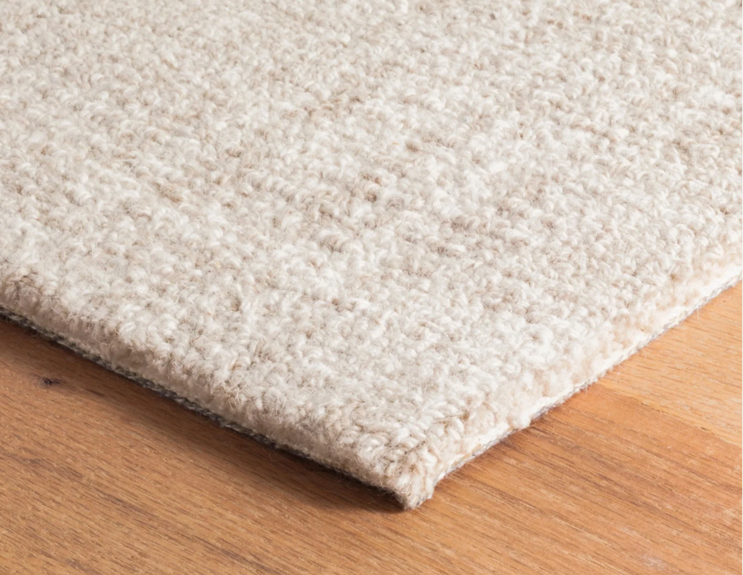 Close-up of the Annie Selke Crosshatched Ivory wool rug texture.