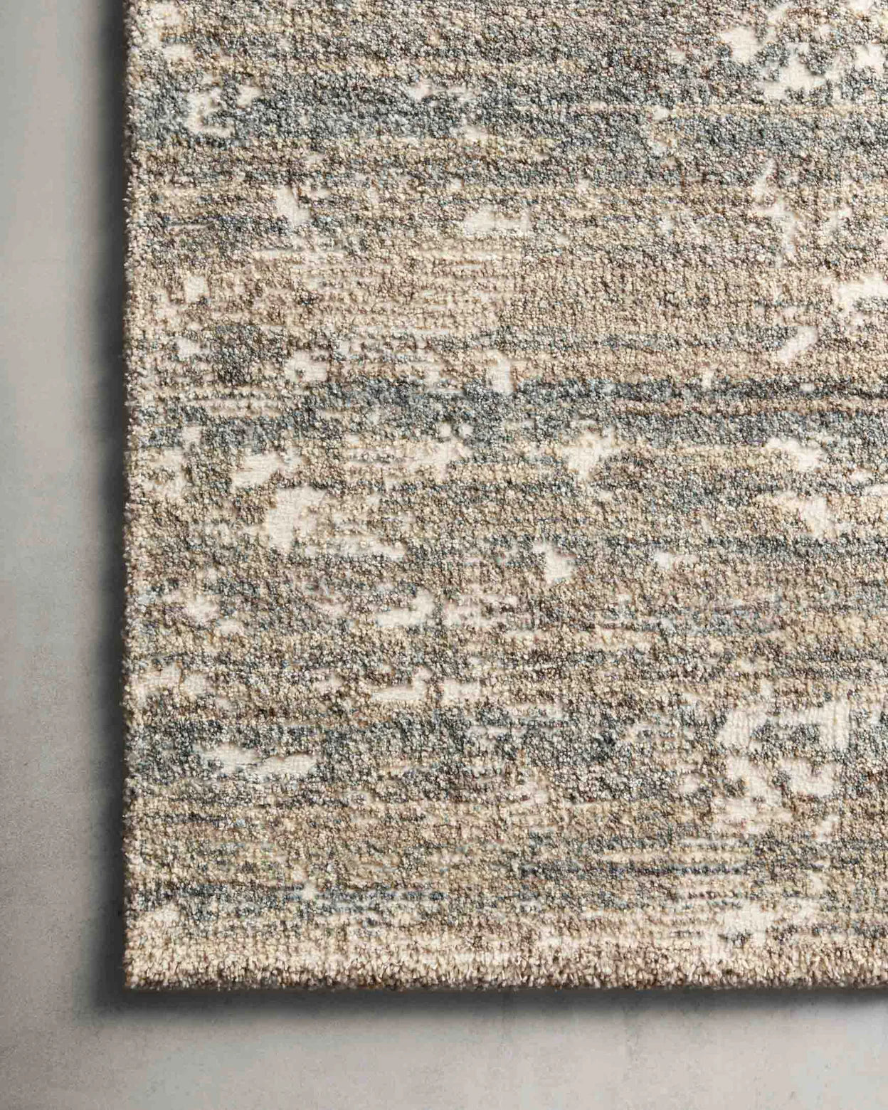 Augustus Fog area rug showing fog-toned color variation.