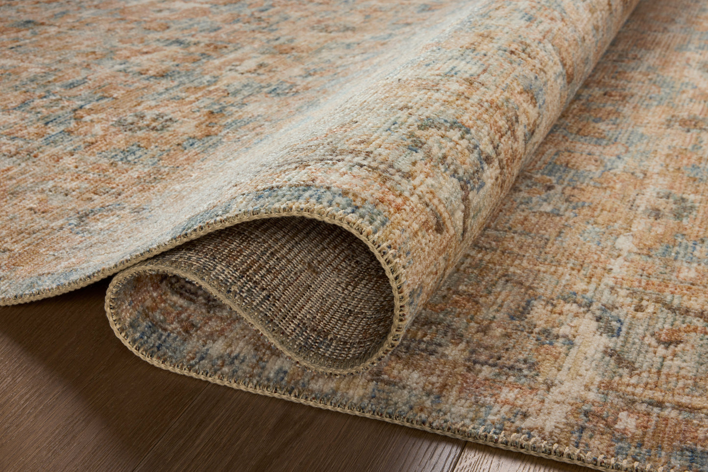 Close-up of the Heritage Ocean/Sand rug variable-pile texture