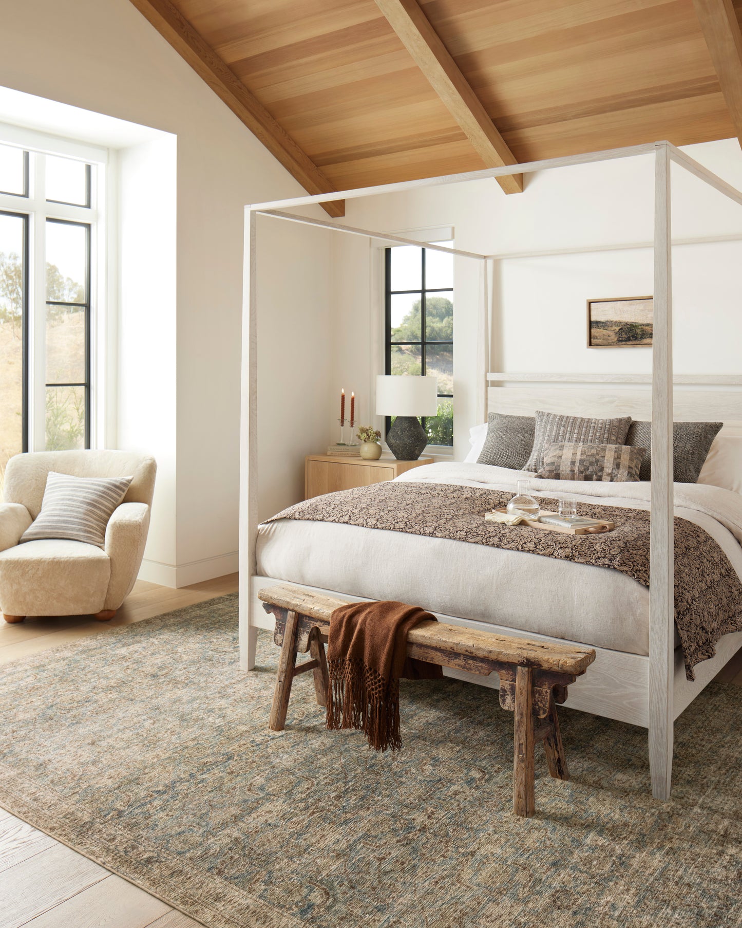 Morgan Sea/Sage area rug styled in a bedroom