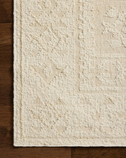 Alara Ivory/Natural area rug styled in a neutral room