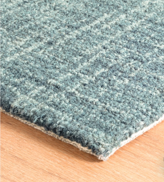 Close-up of the Annie Selke Crosshatched Aegean wool rug texture.
