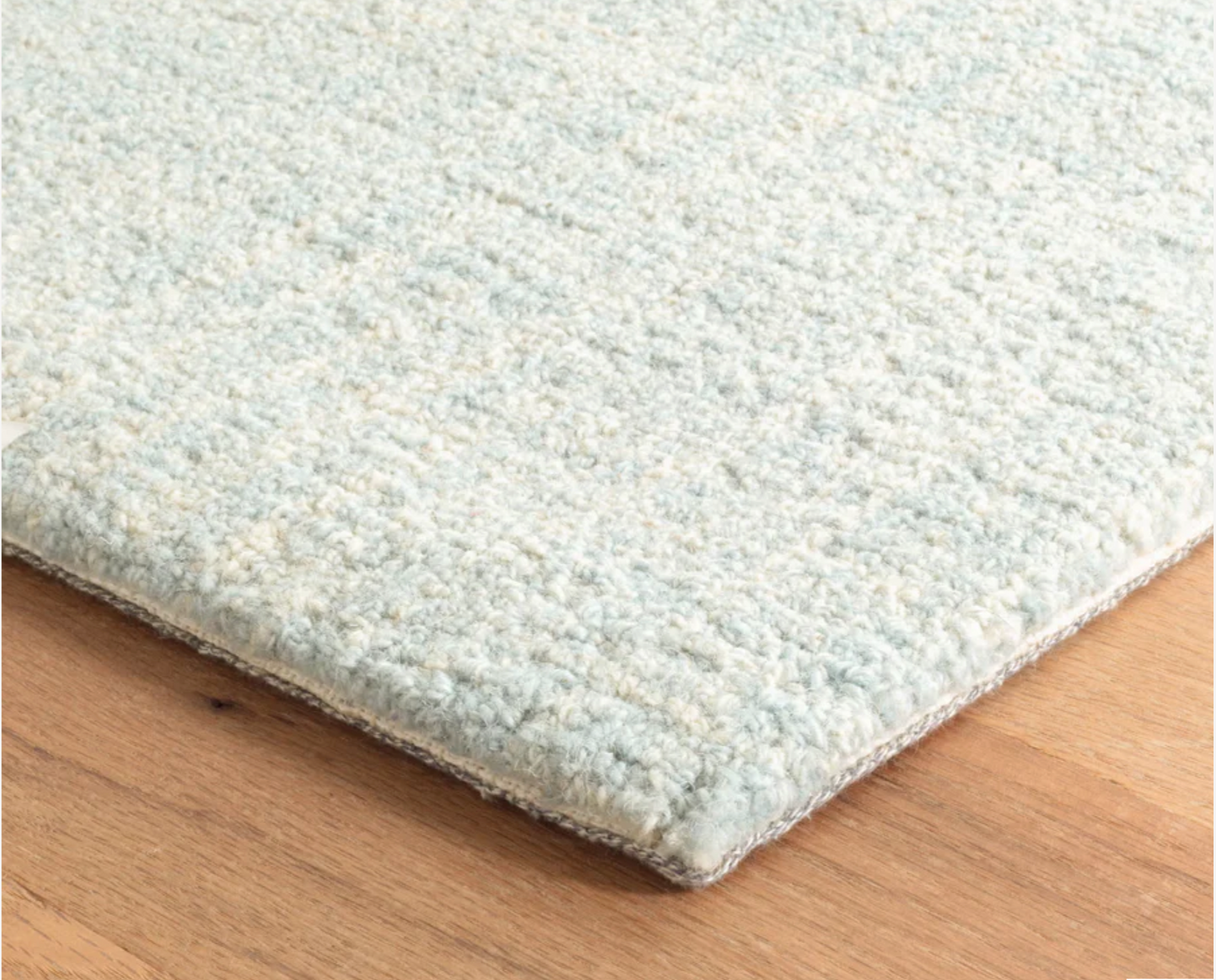 Close-up of the Annie Selke Crosshatched Sky wool rug texture.