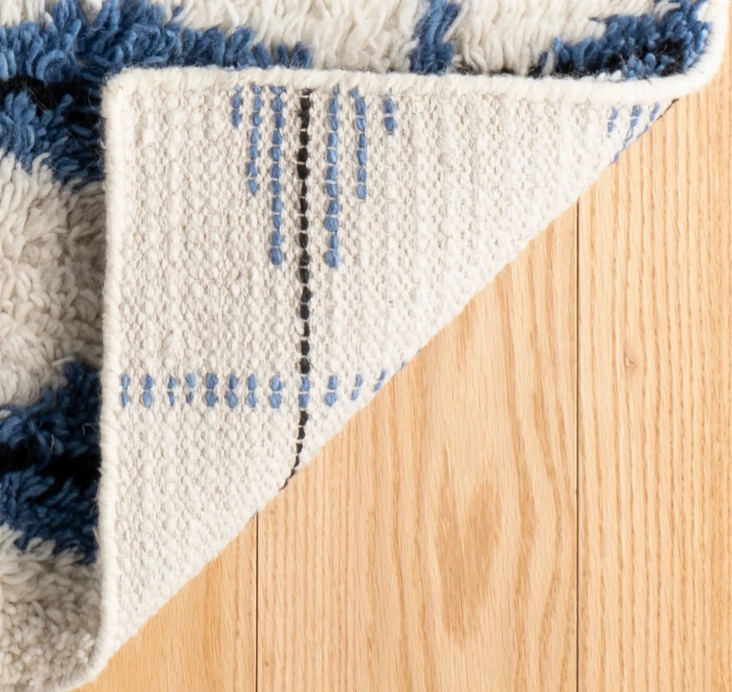 Annie Selke Noma Indigo rug showing high pile and diamond pattern with no rug backing