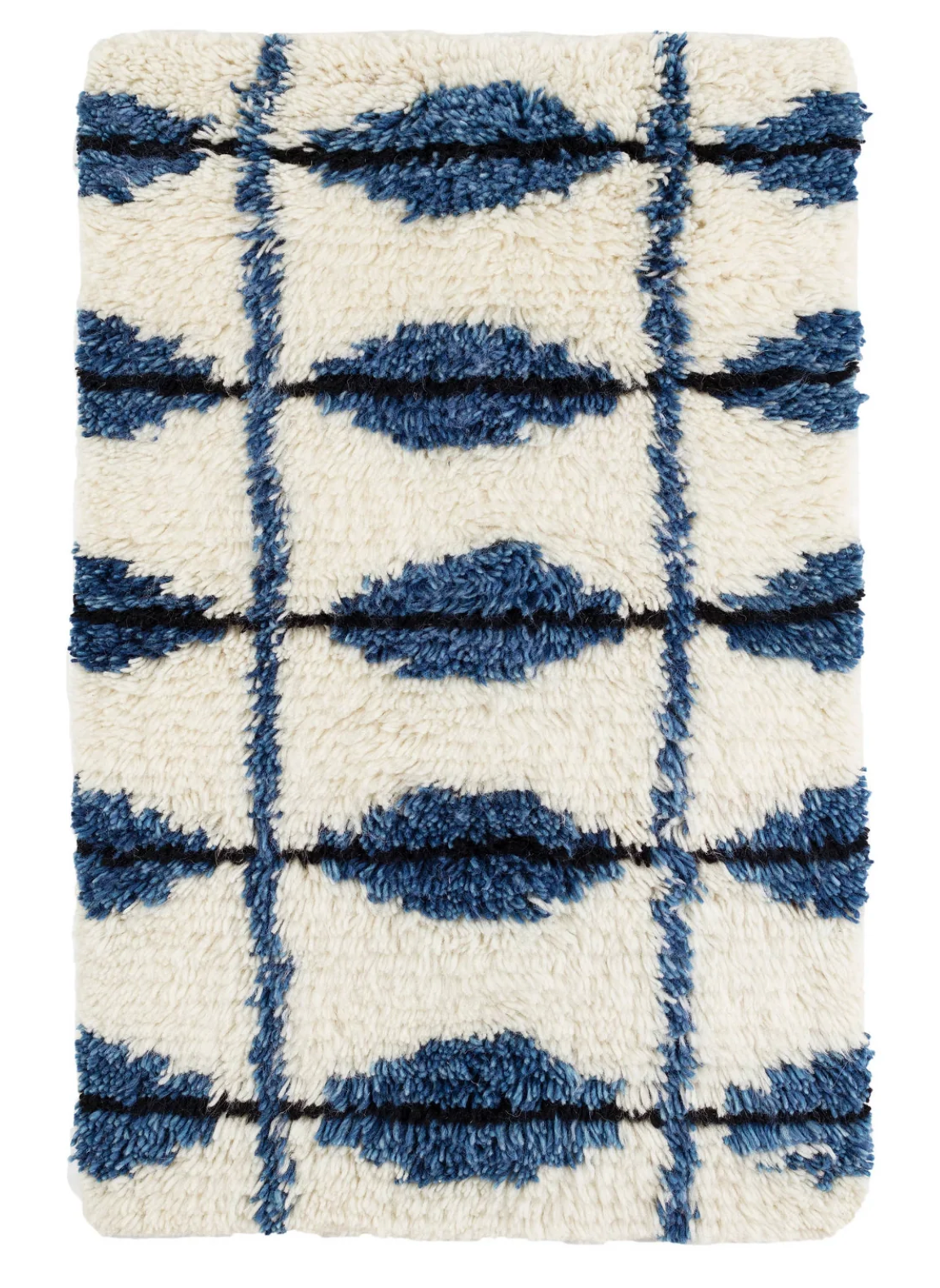 Annie Selke Noma Indigo wool-blend rug with ivory tufts and ink diamond pattern.