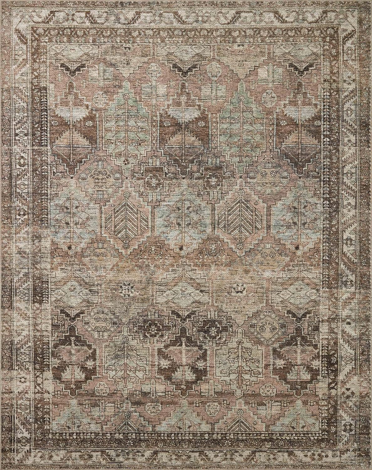 Billie Clay/Sage Amber Lewis x Loloi rug with distressed vintage-inspired pattern.