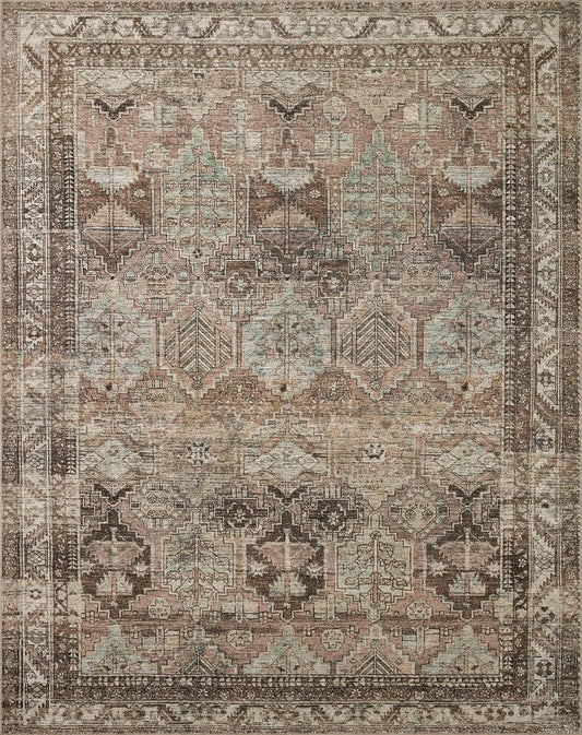 Billie Clay/Sage Amber Lewis x Loloi rug with distressed vintage-inspired pattern.