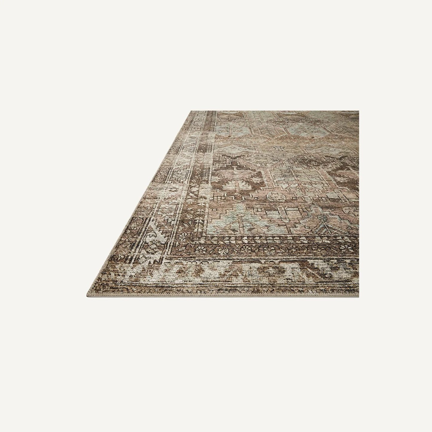 Side view of the Billie Clay/Sage rug distressed texture