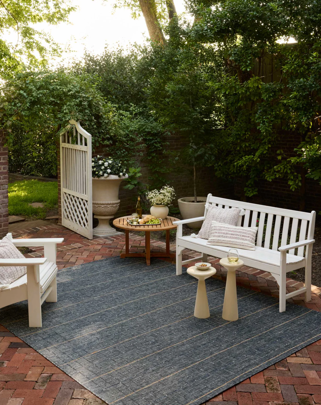 Birch Sky/Wheat area rug styled in a outdoor space