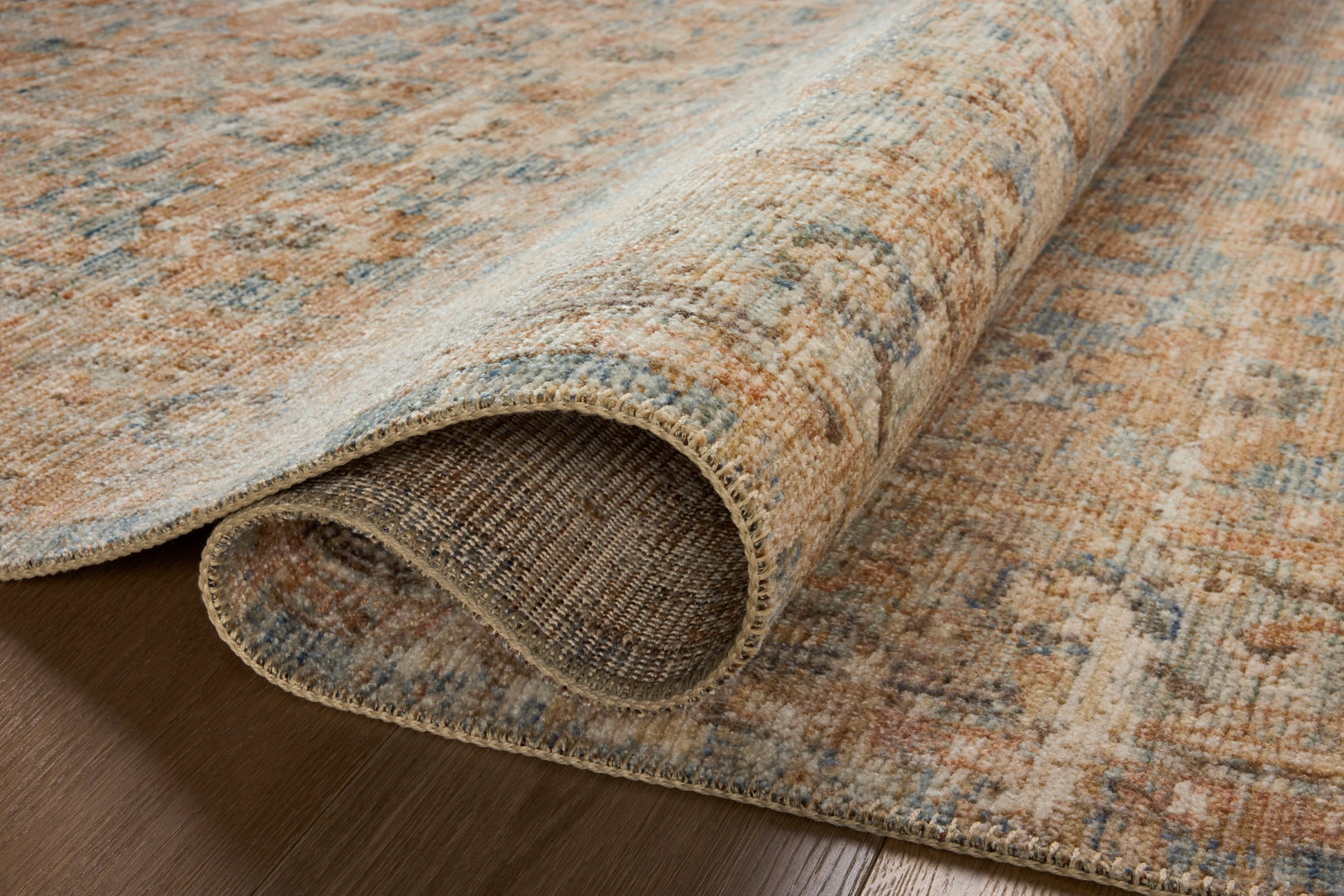 Close-up of the Heritage Ocean/Sand rug variable-pile texture