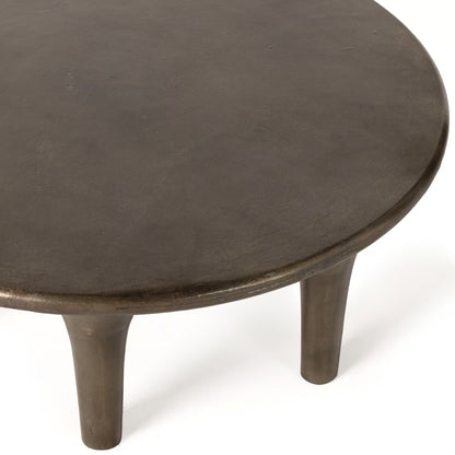 Round wooden table with four legs on a white background
