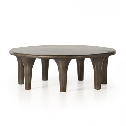 Round wooden coffee table with a rustic finish on a white background