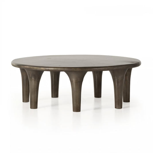 Round wooden coffee table with a rustic finish on a white background