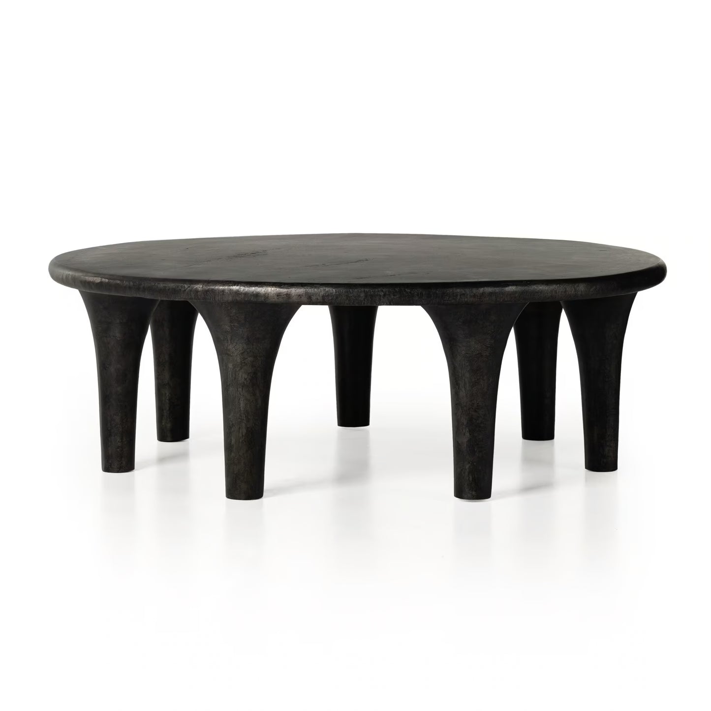 Round black table with unique legs on a white background