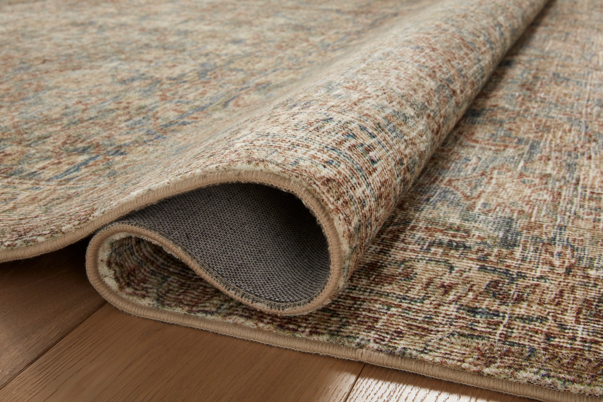 Close-up of the Morgan Sea/Sage rug printed texture