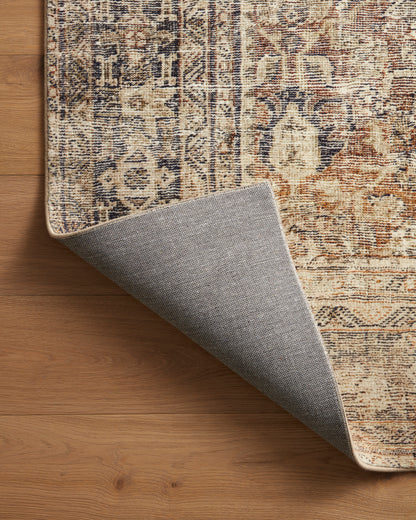 Morgan Sunset/Ink rug showing sunset and ink color variation on wood floor