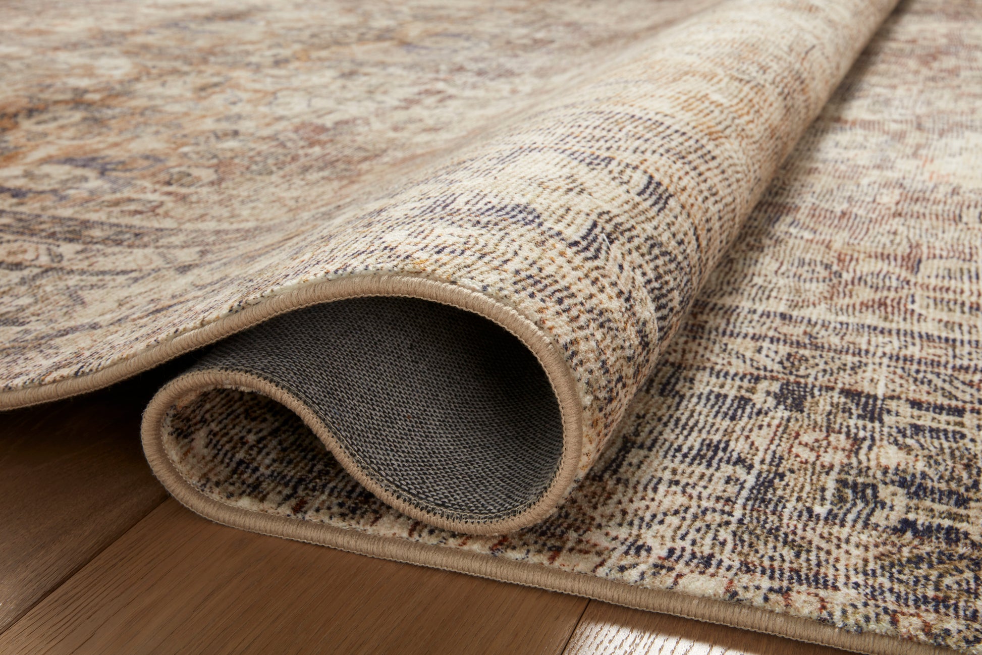 Side view close-up of the Morgan Sunset/Ink rug printed texture