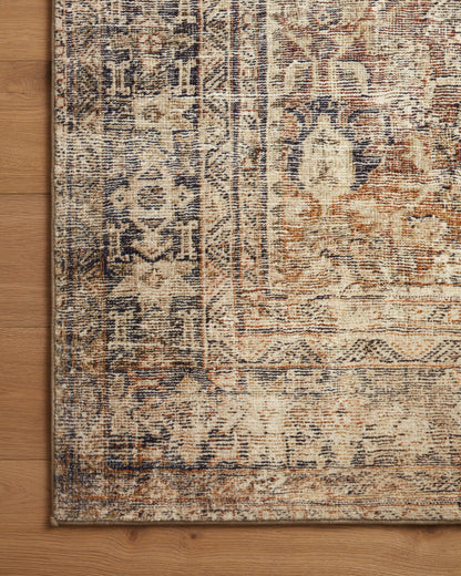Close-up of the Morgan Sunset/Ink rug printed texture on wood floor
