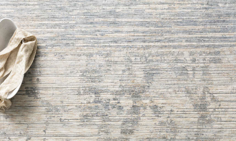Pandora Ivory Blue rug styled in a layered living space