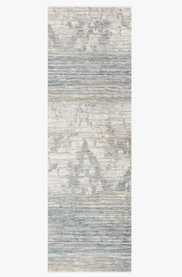 Ivory and blue patterned polyester rug with low pile