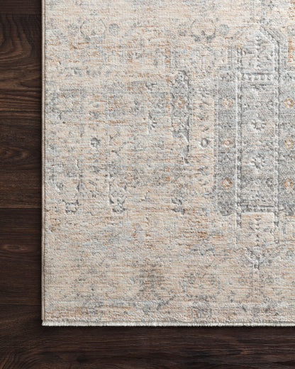 Pandora Ivory/Mist area rug styled in a refined living room