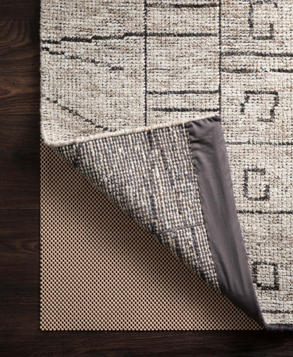 Premium Grip Rug Pad with waffle texture for added cushion and rug stability.