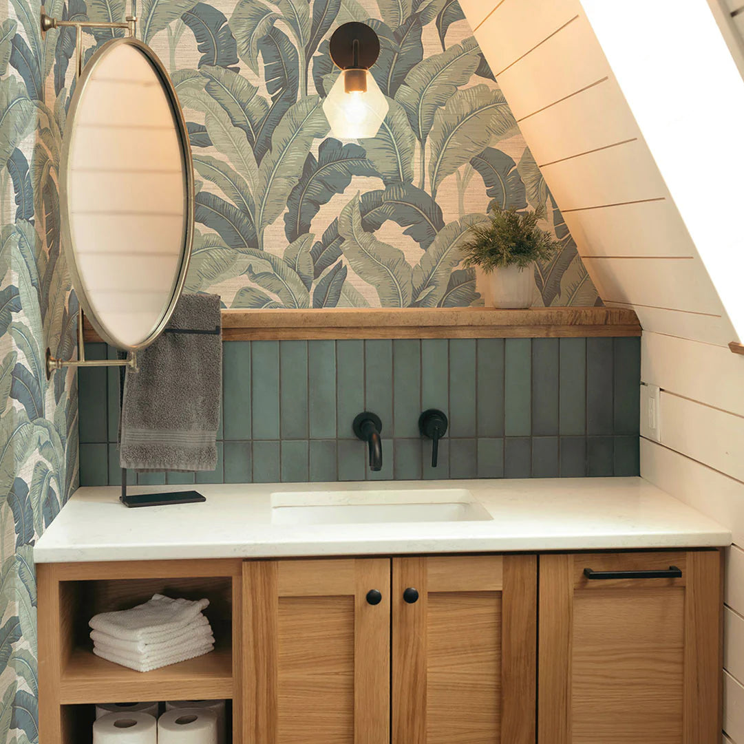 Wallpapered powder room with layered lighting and curated decor in a Beaufort County home