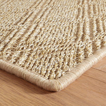 Close-up of the Willa braided woven hemp rug in natural