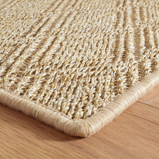 Close-up of the Willa braided woven hemp rug in natural